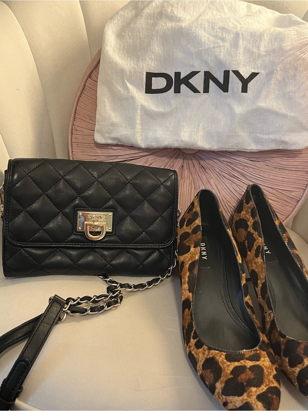 DKNY Black Quilted Leather Crossbody with Gold-Tone Lock and shoes paired